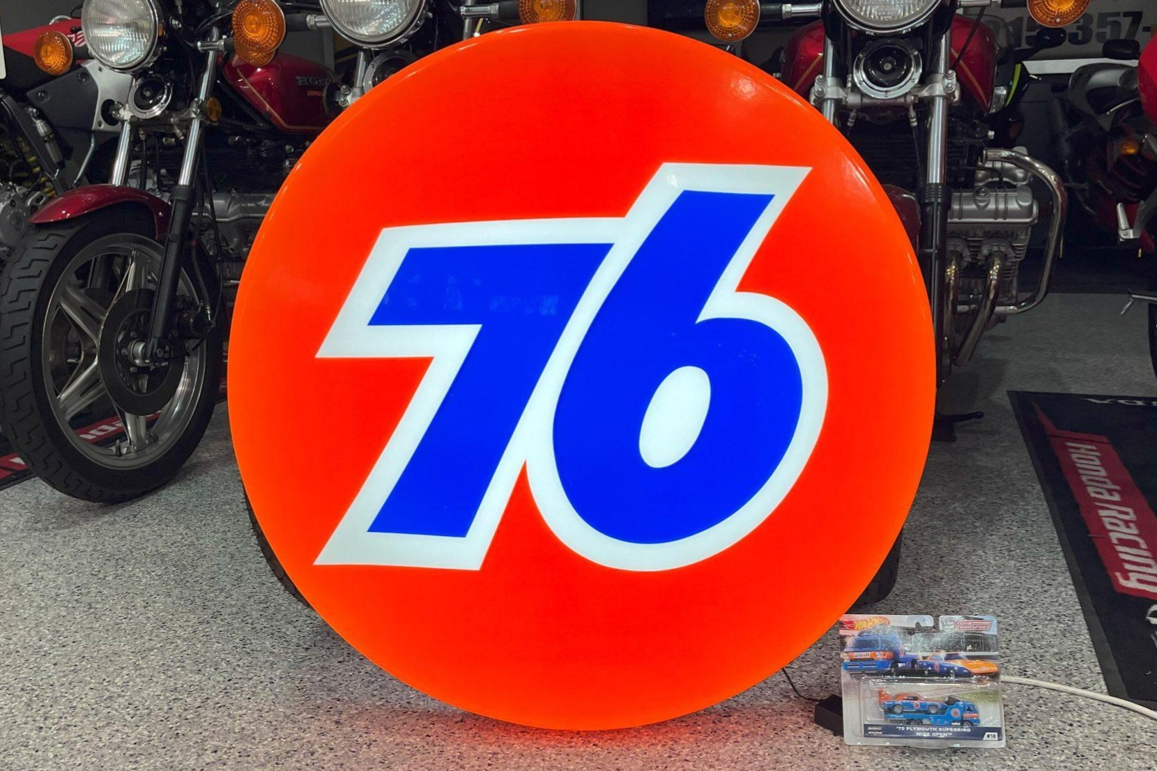 Illuminated 76 Sign